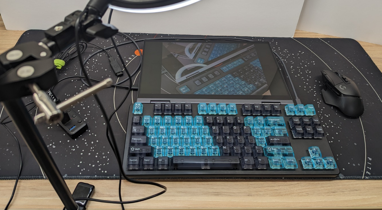 View from above of ring light and webcam pointed down at computer screen