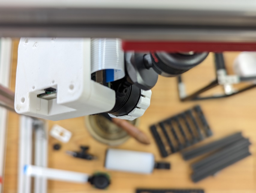 3d printed bracket holding a camera on a T-Slot frame