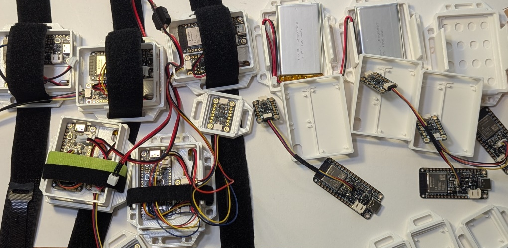 A bunch of DIY SlimeVR trackers partially built